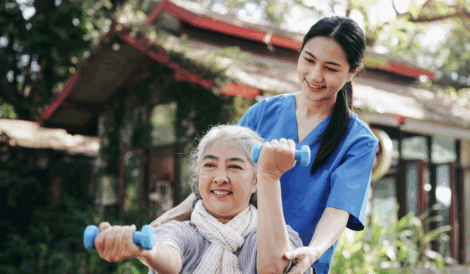 Support worker assisting a client with rehabilitation exercises, demonstrating one of the diverse roles available with the CHC33021 Certificate III in Individual Support.